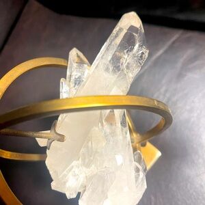 Large quartz crystal with brass globe holder